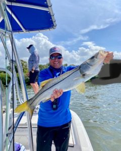 Captain Chris Miller holding a snook caught during a guided fishing trip